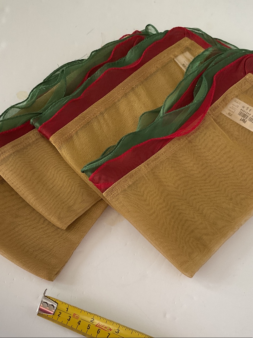 Pier 1 Gold table napkins with Red & Green Trim set of 4